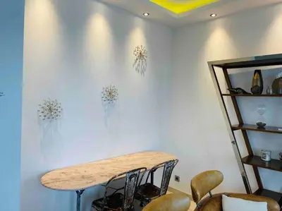 a dining room with a table and some chairs at Wow this view! 2BR facing Old Port 4th floor Olam Properties in Cannes
