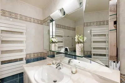 a bathroom with a sink and a mirror at Gabriel YourHostHelper in Cannes