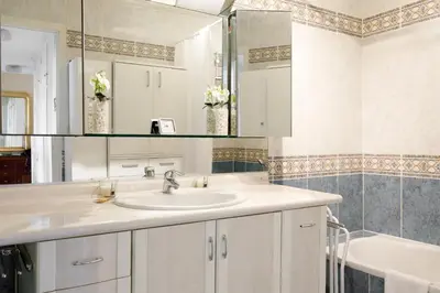 a bathroom with a sink and a mirror at Gabriel YourHostHelper in Cannes