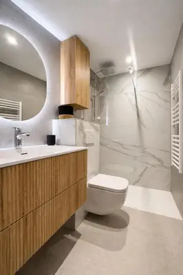 a bathroom with a toilet and a sink at Suite Suquet plage - 5 places in Cannes