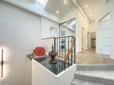 a staircase in a house with a glass table at Le Duplex by Winsome Destination in Cannes