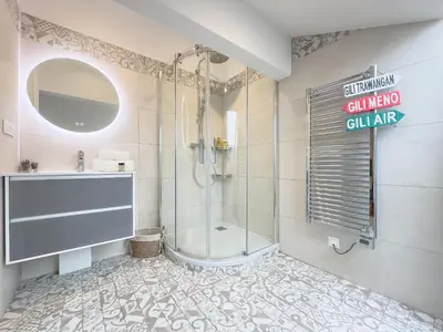 a bathroom with a shower and a sink at Le Duplex by Winsome Destination in Cannes