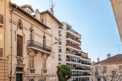 a tall building with balconies on the side of it at Grand Studio Cannes - 5min Plages & Gare & Palais des Festivals - Climatisation in Cannes