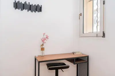 a desk with a chair and a mirror at Cannes 3 pièces Rénové 2023 Vieux Port et Palais Olam Properties in Cannes