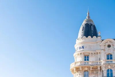 a building with a dome on top of it at 2 BR Croisette balcony & sea view Olam Properties in Cannes