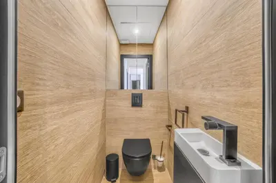 a bathroom with a toilet and a sink at 3 chambres Modern - 2 min du Palais - Climatisé - Calme in Cannes