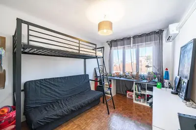 a bedroom with a bunk bed and a desk at Wonderful 2 bedroom apartment with sea view in Cannes