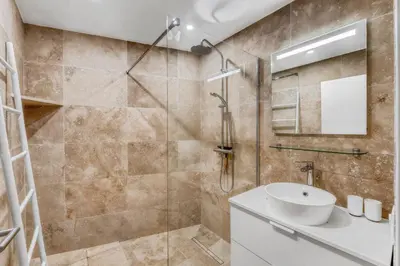 a bathroom with a sink and a shower at 1 Chambre - Ascenseur - Spacieux - Proche palais in Cannes
