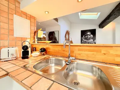 a kitchen with a sink and a counter top at Charmant Appartement à 50m du Palais des Festivals et de la Croisette in Cannes