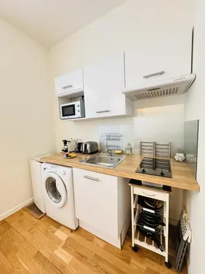 a kitchen with a sink and a washing machine at Studio chaleureux proche croisette Mimont29 in Cannes