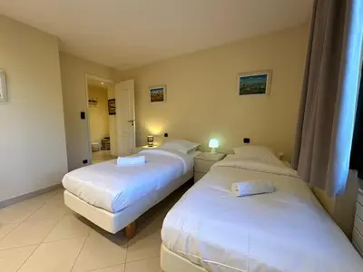 a bedroom with two beds and a bathroom at A003-Magnifique appartement proche du centre de Cannes in Cannes