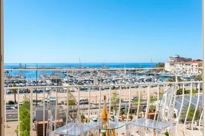 a view of a parking lot with cars at REF 1926 - Cannes Center - Sea view apartment for rent in Cannes