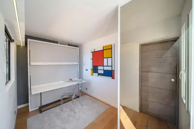 a room with a desk and a door at REF 1926 - Cannes Center - Sea view apartment for rent in Cannes