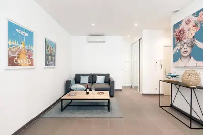 a living room with a couch and a coffee table at Vagliano Standing Presta in Cannes