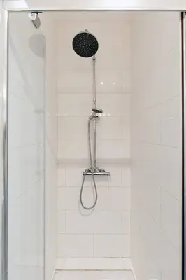 a bathroom with a shower with a glass door at Vagliano Standing Presta in Cannes