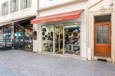 a store front with a bunch of shoes in the window at Vagliano Standing Presta in Cannes