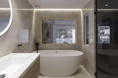 a bathroom with a large tub and a shower at Luxury Penthouse Montfleury by Halldis in Cannes