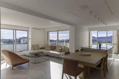 a living room with a couch and a table at Luxury Penthouse Montfleury by Halldis in Cannes