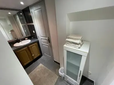 a small bathroom with a sink and a mirror at Holiday Home l'Angelet in Vallauris