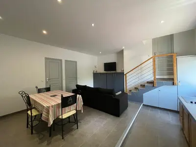 a living room with a table and a couch at Holiday Home l'Angelet in Vallauris