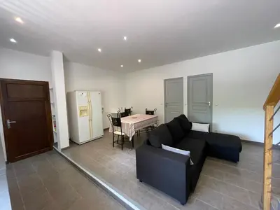 a living room with a couch and a table at Holiday Home l'Angelet in Vallauris