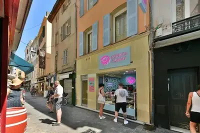 a group of people standing in front of a store at B062-Studio palais des festivals in Cannes