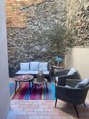 a patio with a couch and two chairs and a table at C098- Cannes - Suquet Bel appart - Grande Terrasse in Cannes