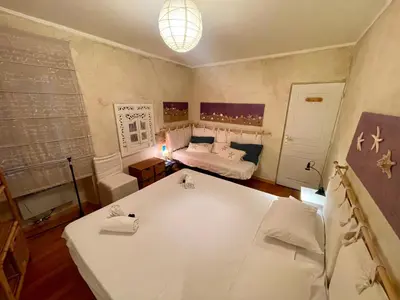 a small room with a bed and a table at Le Suquet Style IV by Connexion in Cannes