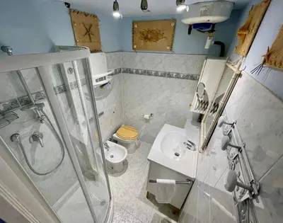 a bathroom with a shower and a toilet and a sink at Le Suquet Style IV by Connexion in Cannes