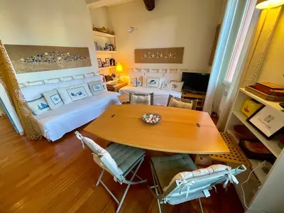 a room with a bed and a table and chairs at Le Suquet Style IV by Connexion in Cannes