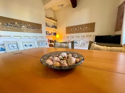 a bowl of vegetables sitting on a wooden table at Le Suquet Style IV by Connexion in Cannes