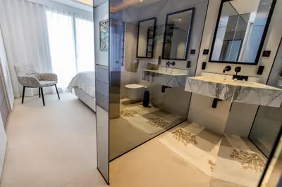 a bathroom with two sinks and a bed at The RoofTop by Connexion in Cannes