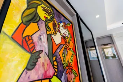 a painting of a woman on a train at The RoofTop by Connexion in Cannes