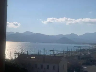 a view of a body of water with a building at Bord de mer et commerces 588 in Cannes