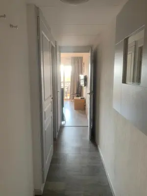 an empty hallway with a hallway leading to a room at Bord de mer et commerces 588 in Cannes