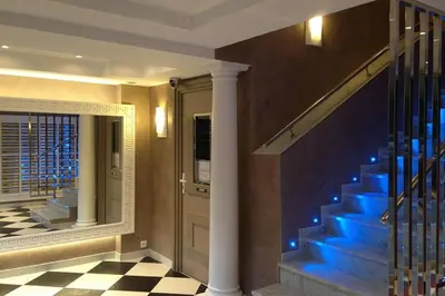 a hallway with blue stairs in a house at Wdf studio right in the heart of Cannes!! in Cannes