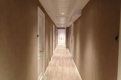 an empty corridor with a door in a room with a corridorngthngthngthngth at Wdf studio right in the heart of Cannes!! in Cannes