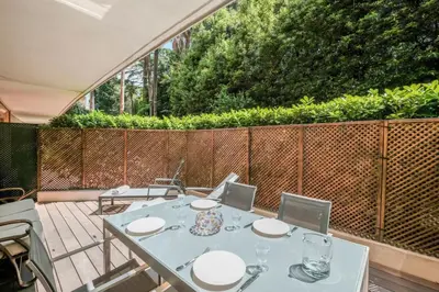 a patio with a table and chairs and a fence at Wdf one bedroom heart of Cannes in Cannes