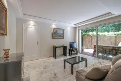 a living room with a couch and a table at Wdf one bedroom heart of Cannes in Cannes