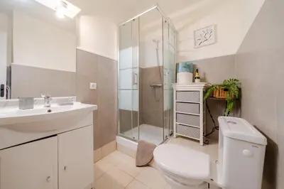 a bathroom with a toilet and a shower and a sink at Cannes Croisette Studio 3 pers Cosy CLIM WIFI PKG in Cannes