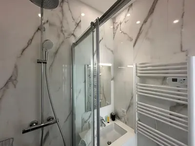 a bathroom with a shower and a sink at B080- À l'étroit à l'hôtel Bienvenue chez nous in Cannes