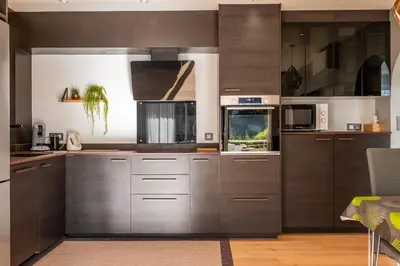 a large kitchen with stainless steel cabinets and appliances at Bright 2bedroom apartment 15min walk to the Palais in Cannes