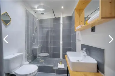 a bathroom with a shower and a toilet and a sink at Appartement Canne 1 chambre - 12RP in Cannes
