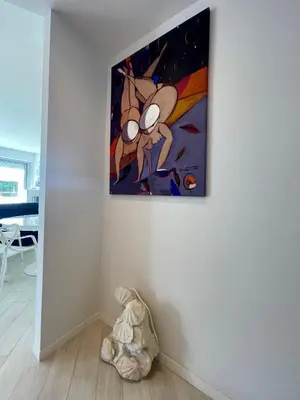 a living room with a room with a wine rack at Le President II by Connexion in Cannes