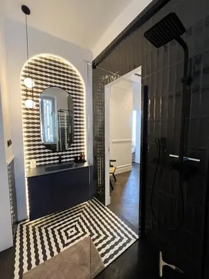 a bathroom with a mirror and a sink at Luxury Cannes in Cannes