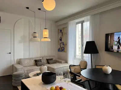 a living room with a couch and a table at Luxury Cannes in Cannes
