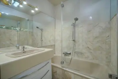 a bathroom with a sink and a shower and a tub at One Bed Apt in the center of Cannes - 2198 in Cannes