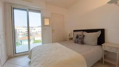 a living room with a couch and a table at Villa Norma in Cannes