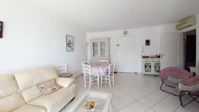 a bedroom with a black and white bed and a balcony at Villa Norma in Cannes
