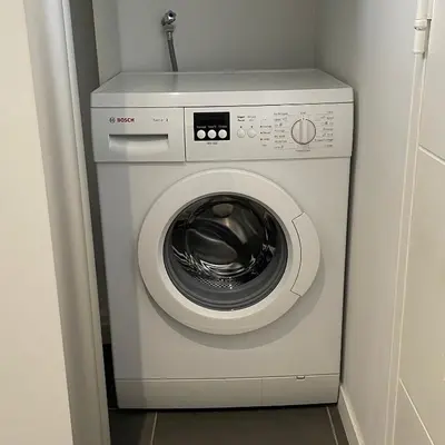 a washer and dryer in a small room at Top Floor Secret Garden, Cannes in Cannes